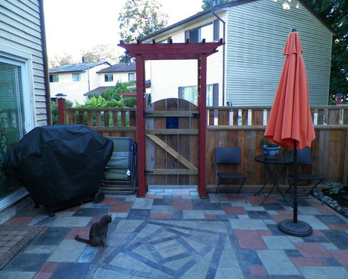 Eclectic Patio Dunedin Small eclectic backyard patio photo with a vegetable garden and concrete pavers