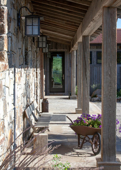 Rustic Veranda by Snake River Interiors
