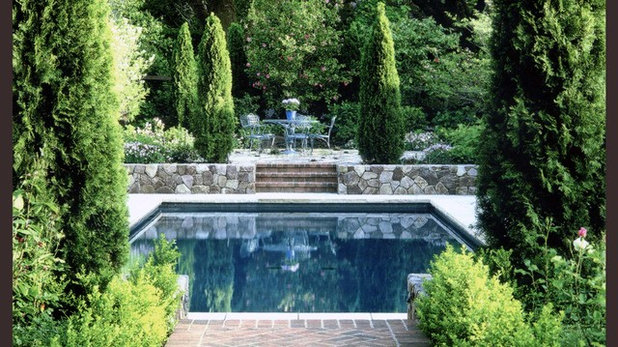 Traditional Pool by Strata Landscape Architecture