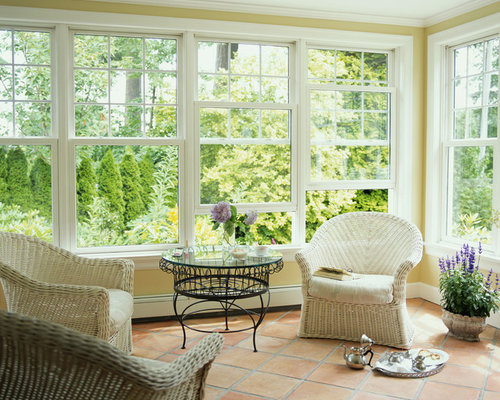 Eclectic Sunroom Cairns Eclectic sunroom photo with terra-cotta floors and a standard ceiling
