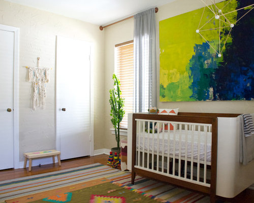 Eclectic Nursery Cairns Inspiration for an eclectic gender-neutral nursery remodel in Dallas with beige walls and medium