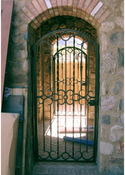 Mediterranean Exterior by Colletti Design Iron Doors