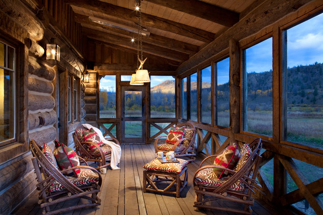 Rustic Porch by Axial Arts Architecture