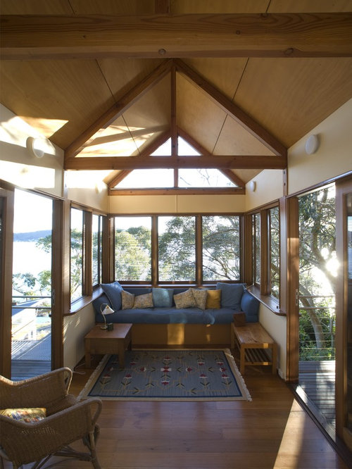 Eclectic Sunroom Sydney Example of a classic sunroom design in Sydney with medium tone hardwood floors and a standard