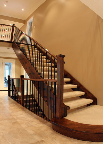 Traditional Staircase by Schnarr Craftsmen Inc