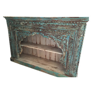 Mogulinterior - Consigned Indian Blue Bookshelf Arched Frame Patina Carved Wood - Rustic hand carved bookcase from India made from an antique door frame that was salvaged from the Havelis of Rajasthan with a warm rustic patina that defines character and age.The texture of teak wood is naturally rich and ages exceptionally well .The shelves and the sides are made from reclaimed sheesham wood which is also a hardwood of the teak family.The crown molding has been done in a step down design and adds a finishing touch to the rustic character of the bookshelf.