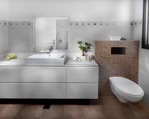 Inspiration for a modern bathroom remodel with a wallmount toilet