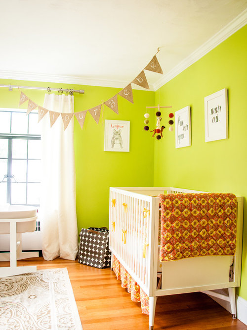 Eclectic Nursery Dublin Eclectic gender-neutral nursery photo in Boston with green walls and medium tone hardwood floors