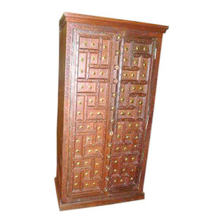Mogul interior - Consigned Solid Wood Cabinet Teak Armoire Colonial India - Fabulous antique rustic cabinet in Natural Teak from India. A focal point for any room. Astounding addition to your wonderland Interiors. Antique doors from palace like homes are reclaimed and used in these armoires. Intricately carved with original hardware and decorative brass all over the door. Handcrafted crown molding add to the beauty of the piece.