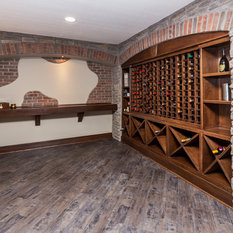 Wine Cellars Stratford  Beautiful rustic wine cellar with brick accent wall and brick arches. Glen-Gery Stratford Thin Brick.
