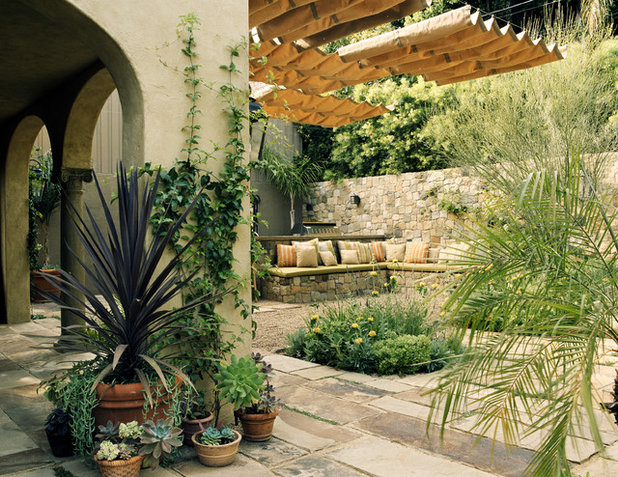 Mediterranean Patio by Tommy Chambers Interiors, Inc.