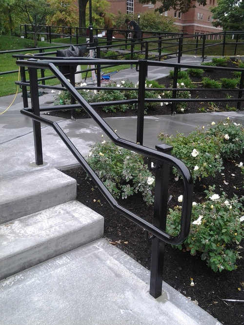 handicapped pipe railing fixed at concrete base