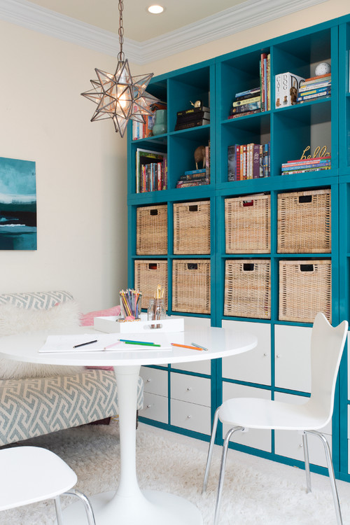 Teal blue built-in cabinets with white modern study table