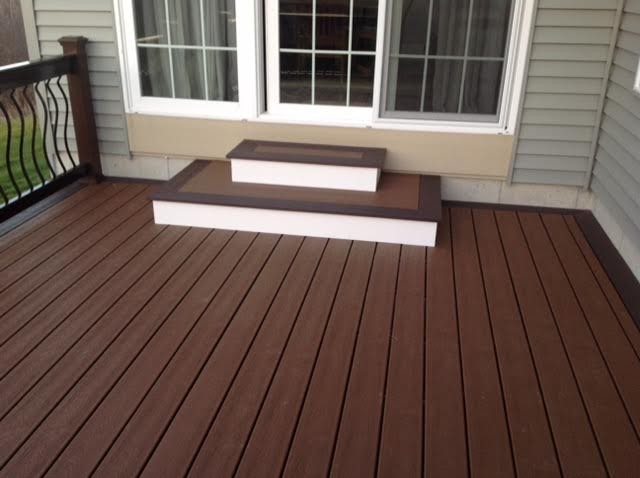 Dark brown Trex deck with contemporary metal railing