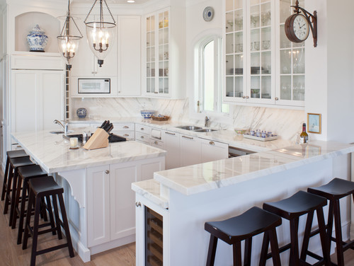 Modern Kitchen Honed Marble Beige Cabinets Marble Create Brass Accents Black Marble Thassos Marble Kitchen With Marble Backsplash Materials Farmhouse Sink Blue Cabinets Brass Faucet Marble Kitchen Backsplash Upper Cabinets