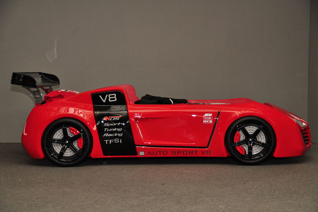 red race car bed with toy box