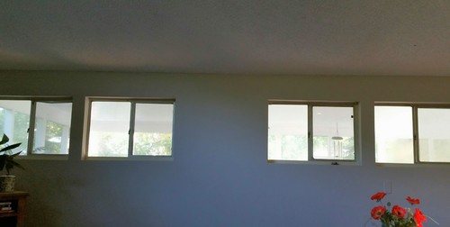 Small, high windows in dining room/living room