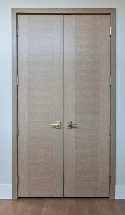 Modern White Oak flush panel doors with a faux stile in Rift White Oak