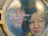 Jethaniel and Yvette peer out of the entry porthole - Eclectic - Entry - other metro - by Louise Lakier - eclectic-entry