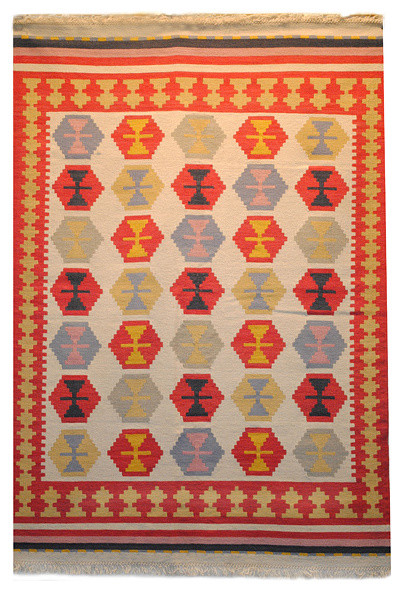how to place an area rug in a bedroom
