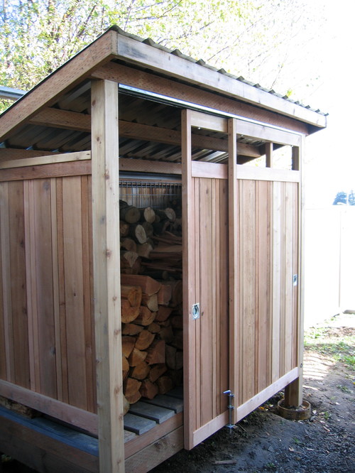 Firewood shed built with reclaimed materials.
