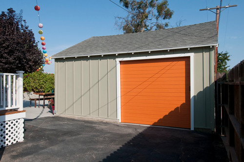 Orange garage door on detached shed