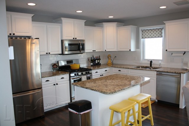 white and grey kitchen with yellow accents
