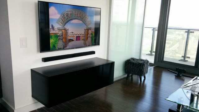 TV wall mounted with Floating Media shelve and Soundbar