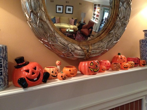 Halloween jack-o-lanterns on mantel.