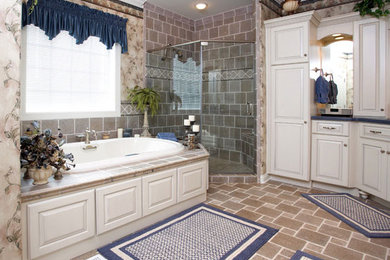 Inspiration for a large contemporary brown tile and porcelain tile porcelain tile and brown floor bathroom remodel in Other with raised-panel cabinets, white cabinets, a one-piece toilet, beige walls, a drop-in sink, quartz countertops, a hinged shower door and gray countertops