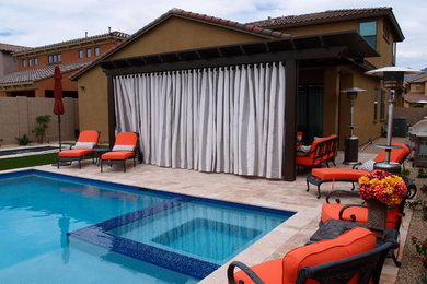 Patio - modern backyard patio idea in Phoenix with a pergola