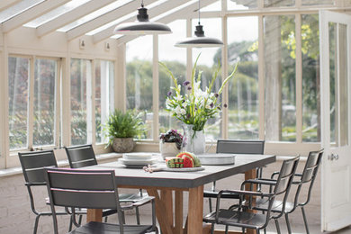This is an example of a rural conservatory in Oxfordshire with a glass ceiling.