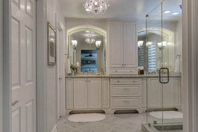Large traditional master bathroom in Los Angeles with an undermount sink, furniture-like cabinets, white cabinets, engineered quartz benchtops, a corner shower, a one-piece toilet, white tile, stone tile, grey walls and marble floors.