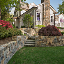 Elevation change and retaining wall