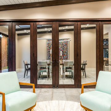 Interior Bi-Fold Doors Separate Formal Sitting Room from Dining Room