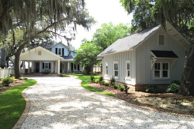 Inspiration for a mid-sized timeless blue two-story concrete gable roof remodel in Miami