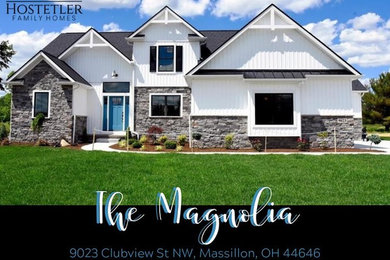 Example of a country home design design in Cleveland