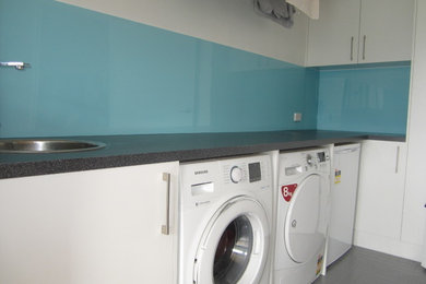 Photo of a mid-sized modern laundry room in Central Coast.