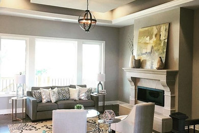 Elegant living room photo in Dallas with a stone fireplace
