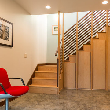 The studio utilizes the space under the stairs.