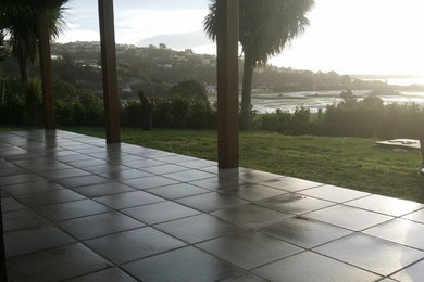 This is an example of a contemporary patio in Christchurch with concrete pavers.
