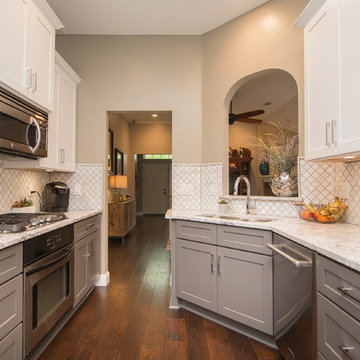 Kitchen | Two-Tone Cabinets | Cambria Quartz | Arabesque Marble Backsplash