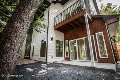 Example of a farmhouse exterior home design in Austin