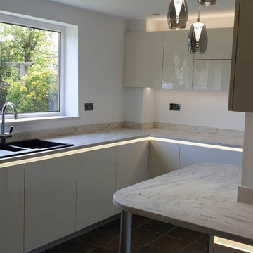 High gloss modern style handleless kitchen.