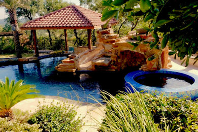 Inspiration for a tropical home design remodel in Austin