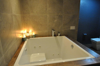 Example of a mid-sized transitional master beige tile doorless shower design in Sacramento with a vessel sink, wood countertops and a hot tub