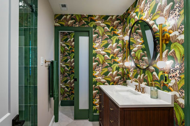 Bathroom - mid-sized mid-century modern kids' green tile and porcelain tile porcelain tile, white floor and wallpaper bathroom idea in Baltimore with furniture-like cabinets, medium tone wood cabinets, a two-piece toilet, green walls, an undermount sink, quartz countertops, white countertops and a freestanding vanity