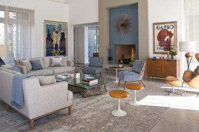 Inspiration for a mid-sized modern open concept living room remodel in Los Angeles with white walls, a standard fireplace and a plaster fireplace