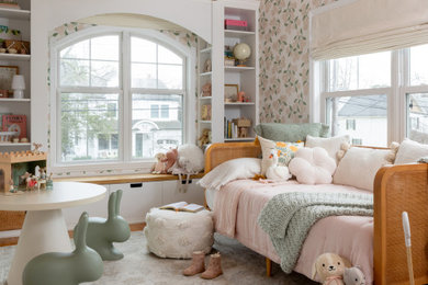 Example of a transitional girl wallpaper kids' room design in New York