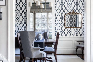 Inspiration for a traditional dining room in Charlotte with white walls and marble floors.